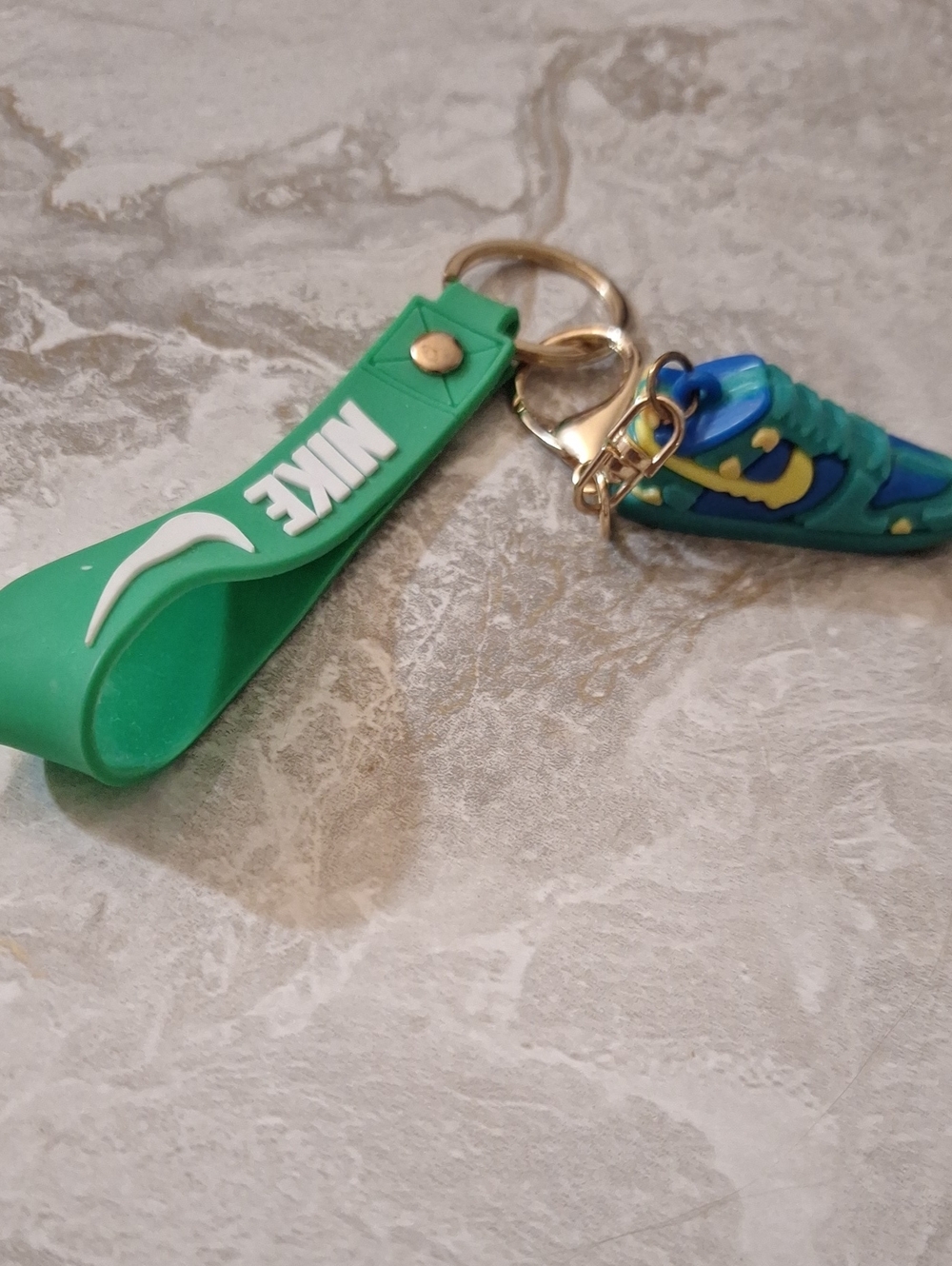 Nike Kids Green Strap Keychain with Blue Sneaker Charm